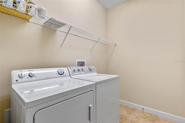 washroom with independent washer and dryer