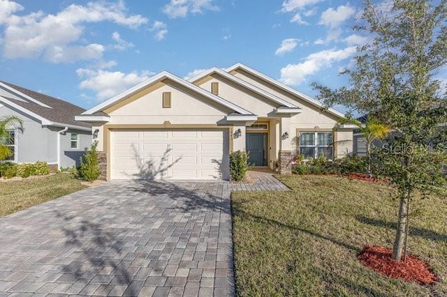 view of front facade with a garage and a front yard