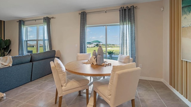 dining area with light tile patterned flooring