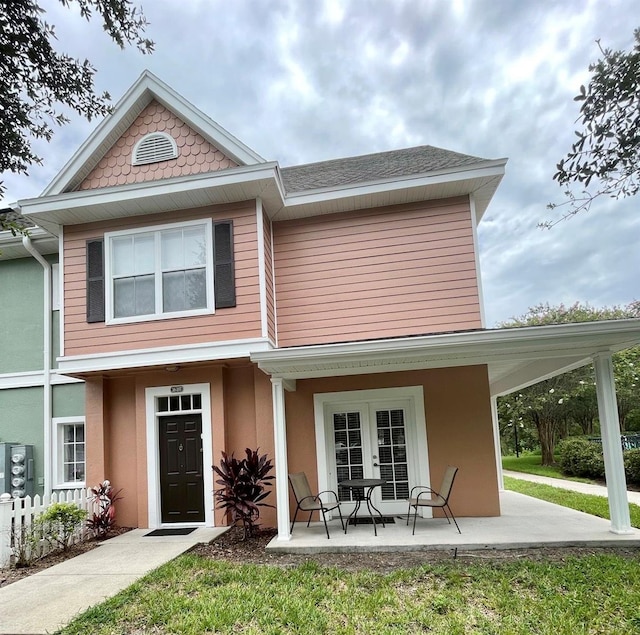 rear view of property with a porch