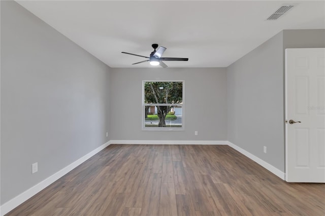 unfurnished room with ceiling fan and wood-type flooring