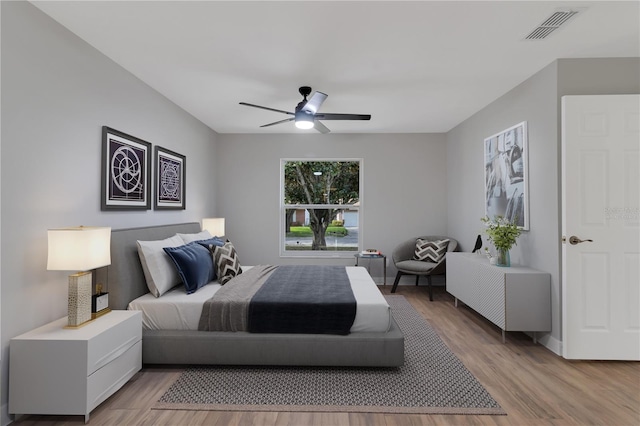 bedroom featuring ceiling fan and light hardwood / wood-style floors