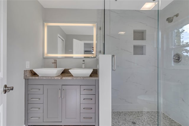 bathroom with vanity and walk in shower