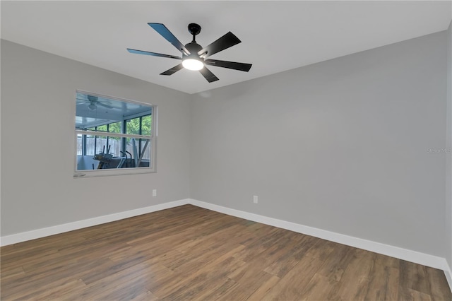 empty room with ceiling fan and hardwood / wood-style floors