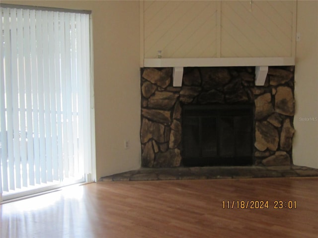 details featuring a fireplace and hardwood / wood-style floors