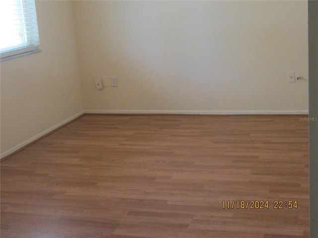 spare room with light hardwood / wood-style flooring