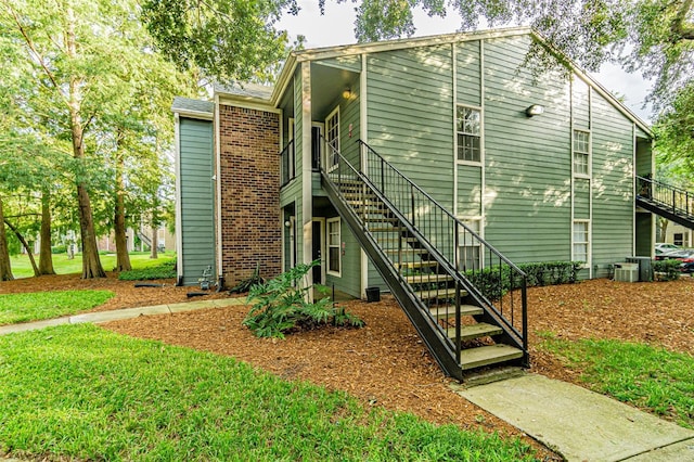 view of side of home with cooling unit