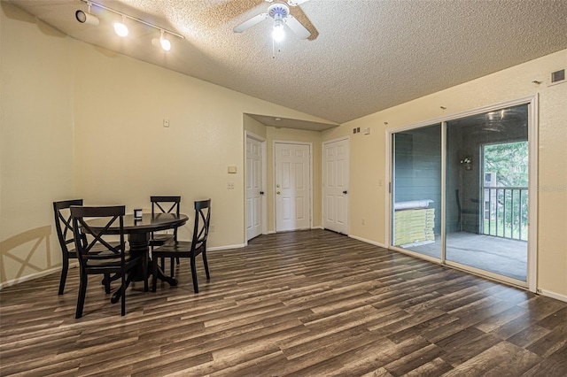 dining area featuring dark hardwood / wood-style floors, ceiling fan, a textured ceiling, and vaulted ceiling