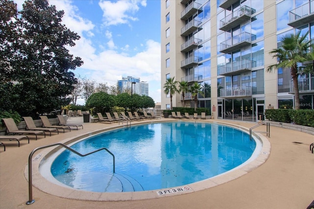 view of swimming pool with a patio area