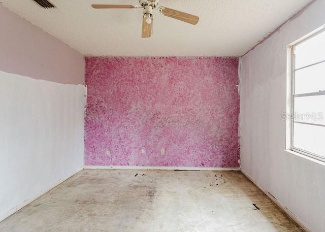 spare room featuring plenty of natural light