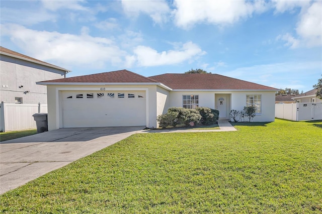 ranch-style house featuring a front yard and a garage