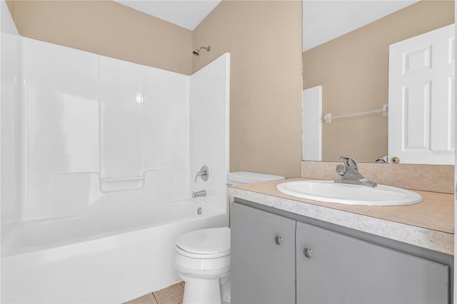 full bathroom featuring toilet, shower / bathing tub combination, vanity, and tile patterned floors