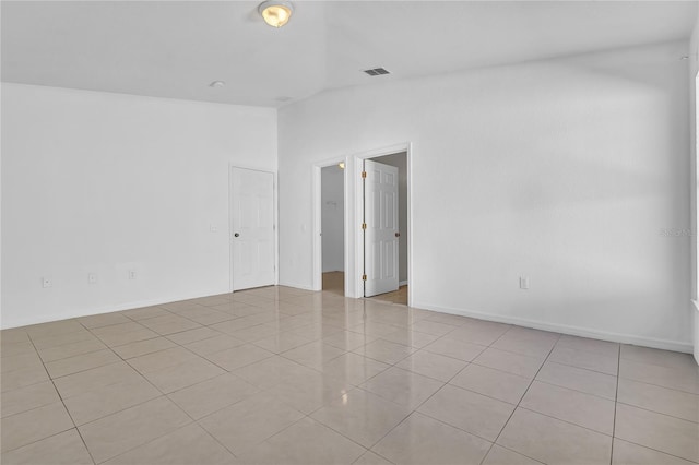 empty room with light tile patterned floors