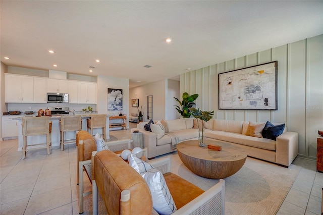 living room featuring light tile patterned flooring