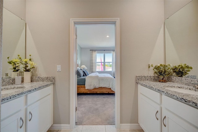 bathroom featuring tile patterned flooring and vanity