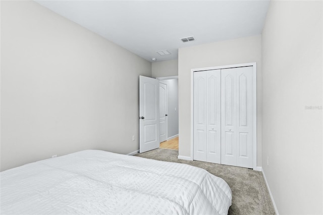 carpeted bedroom featuring a closet