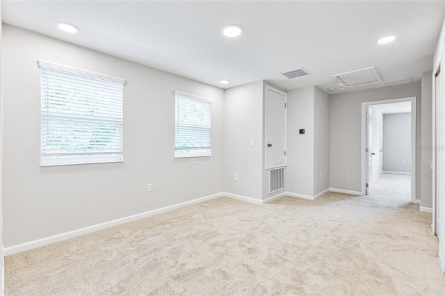 carpeted empty room featuring plenty of natural light