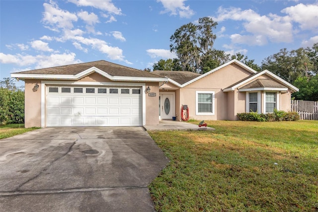 single story home with a front yard and a garage