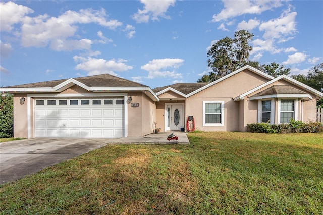 single story home with a front yard and a garage