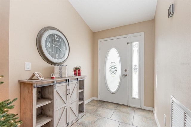 tiled foyer entrance featuring a healthy amount of sunlight