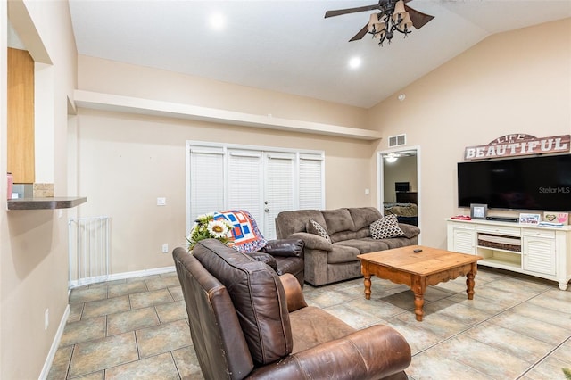 tiled living room featuring ceiling fan and lofted ceiling