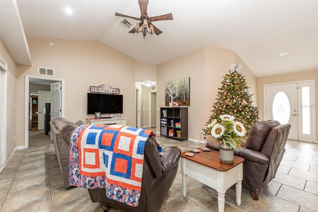 living room featuring ceiling fan and lofted ceiling