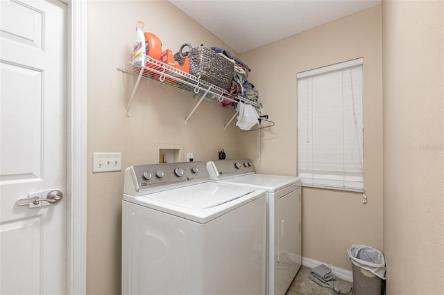 laundry area with independent washer and dryer