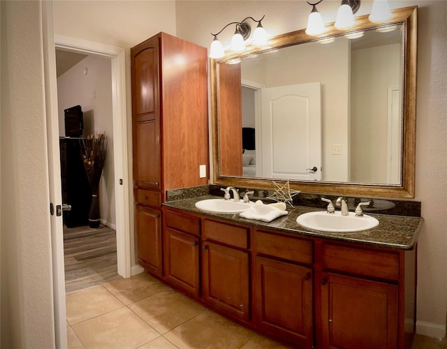 bathroom featuring tile patterned flooring and vanity