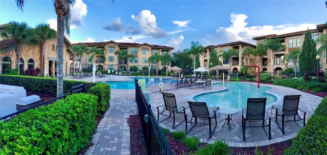 view of swimming pool with a patio area