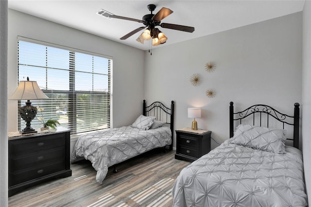 bedroom featuring ceiling fan and hardwood / wood-style flooring