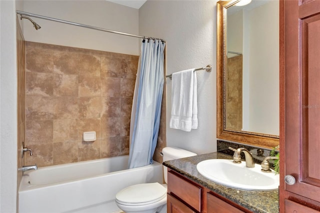 full bathroom with shower / tub combo with curtain, vanity, and toilet