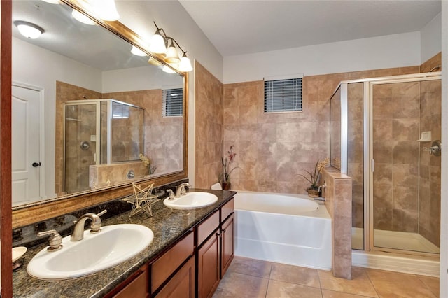 bathroom featuring tile patterned floors, vanity, and plus walk in shower