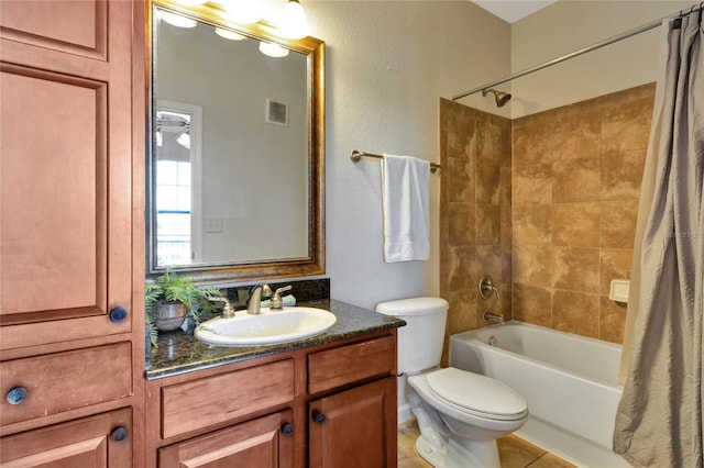 full bathroom featuring ceiling fan, shower / bath combo, tile patterned floors, toilet, and vanity