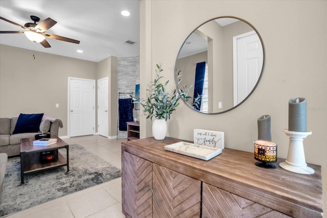 interior space with ceiling fan and light tile patterned floors