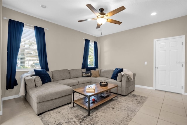 tiled living room featuring ceiling fan and plenty of natural light