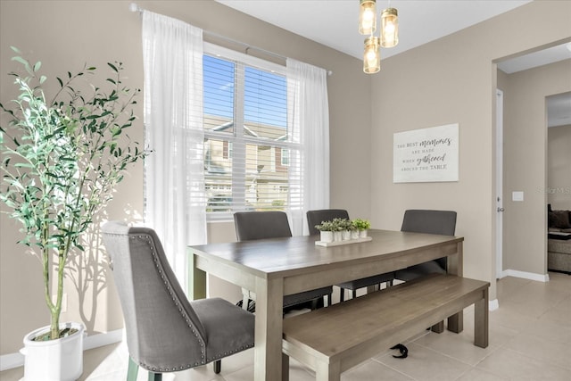 dining area with light tile patterned floors and a wealth of natural light