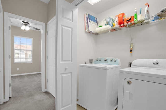 laundry room with light carpet, ceiling fan, and washer and dryer