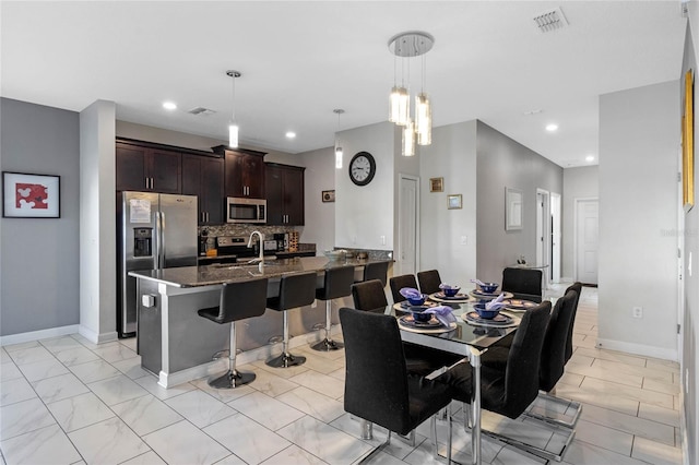 dining room featuring sink