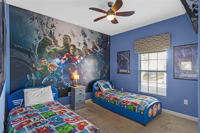bedroom with carpet flooring, baseboards, and a ceiling fan