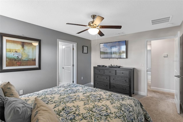 bedroom with baseboards, a ceiling fan, carpet flooring, and visible vents