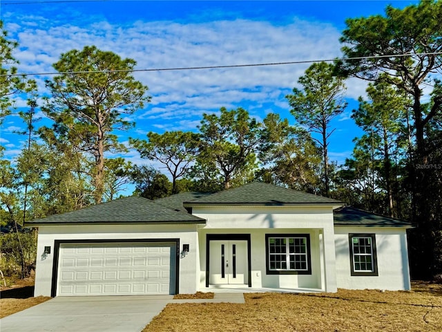 view of front of house with a porch and a garage