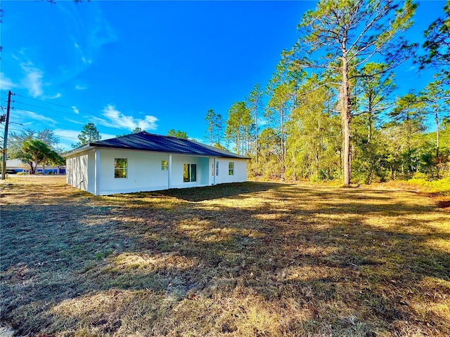 view of home's exterior featuring a lawn