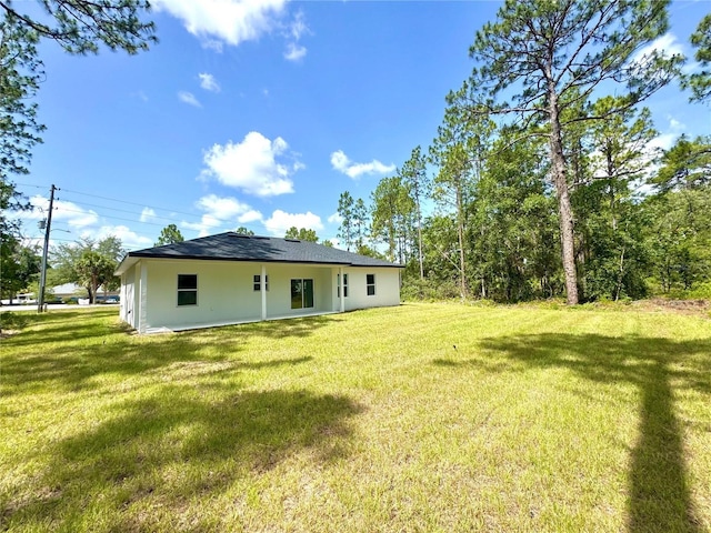 1523 W Citrus Springs Blvd, Citrus Springs, FL 34434 - back of property featuring a yard and stucco siding