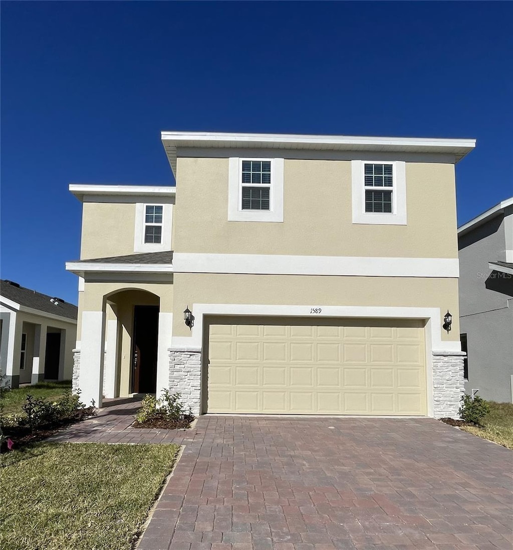 front of property featuring a garage