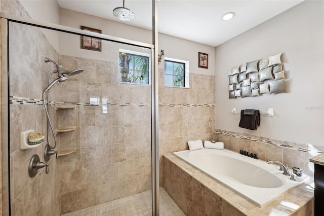 bathroom featuring shower with separate bathtub