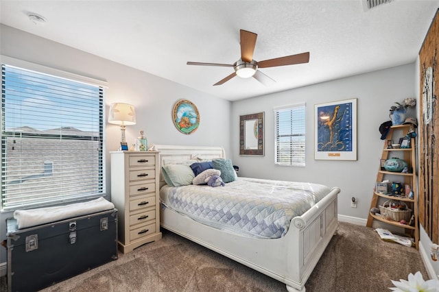 bedroom with ceiling fan and carpet