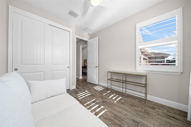 sitting room featuring ceiling fan and dark hardwood / wood-style flooring