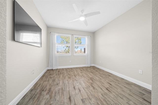 unfurnished room featuring ceiling fan and hardwood / wood-style flooring