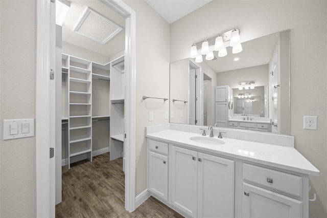 bathroom with hardwood / wood-style flooring and vanity