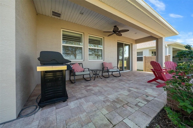 view of patio featuring ceiling fan